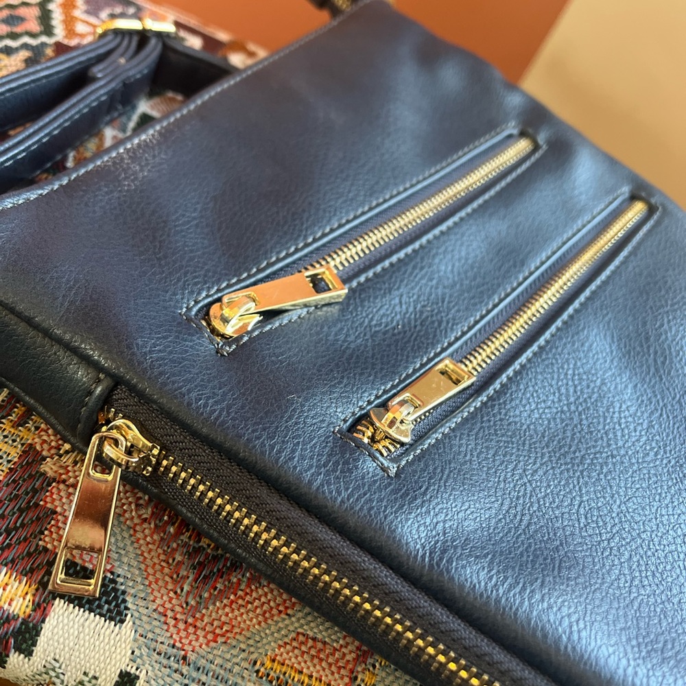Navy with Golder Zipper Simply Noelle Purse with adjustable Shoulder Strap.
